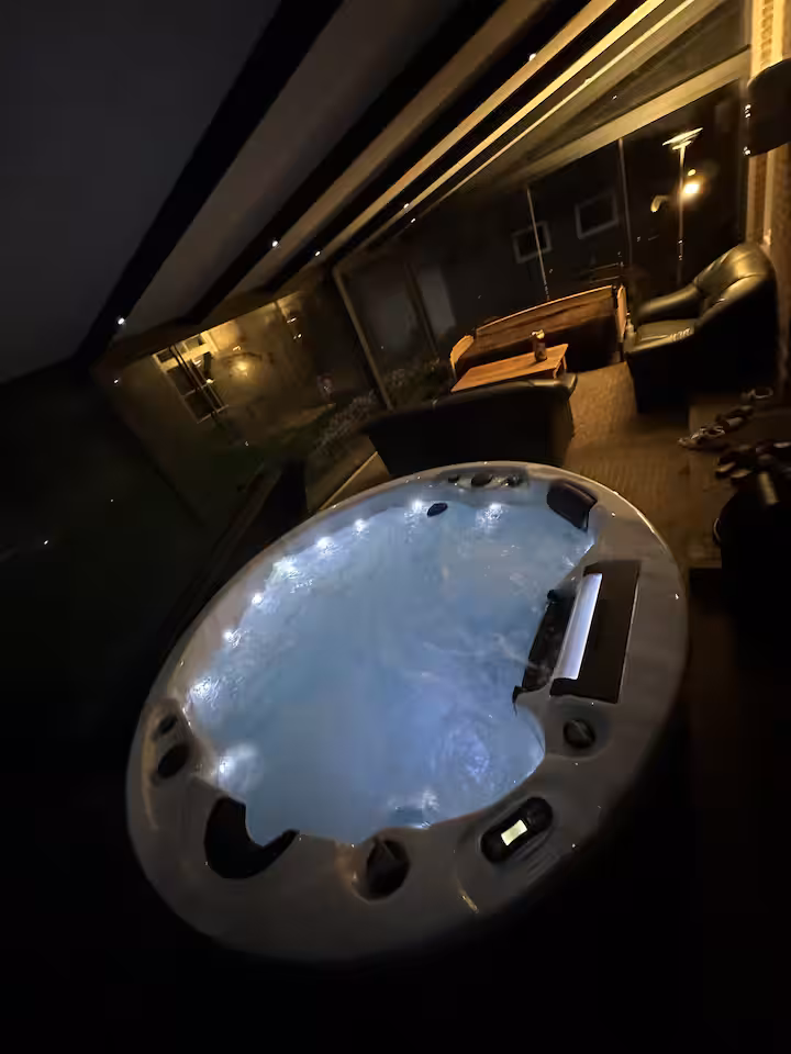 Jacuzzi in the glass veranda at night